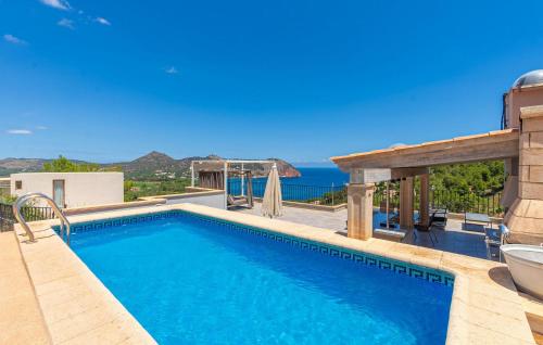 a swimming pool with a view of the ocean at Cap Vermell in Canyamel