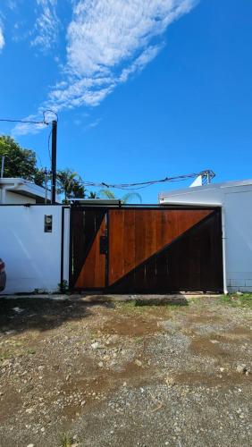 a large wooden door on a building at Los Papyrus in Uvita