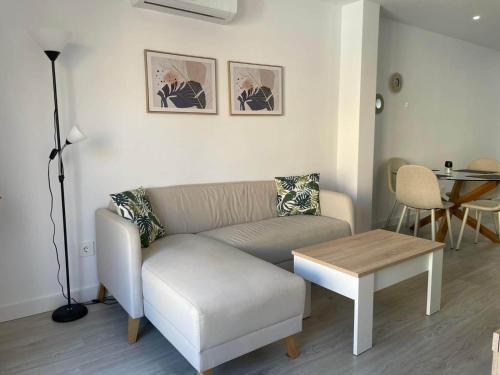 a living room with a couch and a table at Modern Apartment Near Golf, Beach & Marina in San Pedro del Pinatar