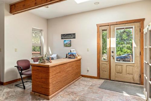 a home office with a desk and a chair at Slot Canyons Inn Bed & Breakfast in Escalante