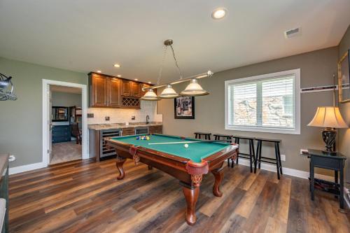 a living room with a pool table in it at Apres Ski by Railey Vacations in McHenry