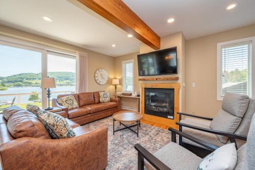 a living room with a couch and a fireplace at Apres Ski by Railey Vacations in McHenry