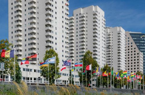 a bunch of flags in front of a building at 1 bedroom appartement in the center of Rotterdam in Rotterdam