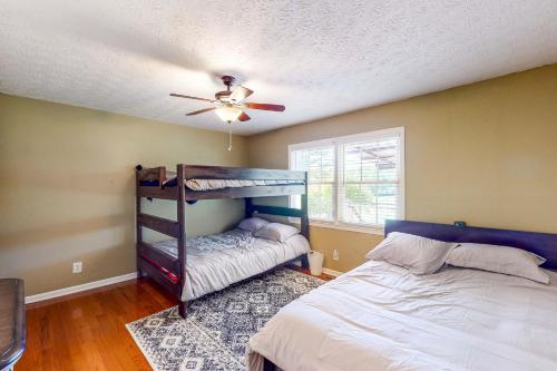 a bedroom with a bunk bed and a ceiling fan at Danielsville Home on Sprawling Acreage w/ Views! in Commerce