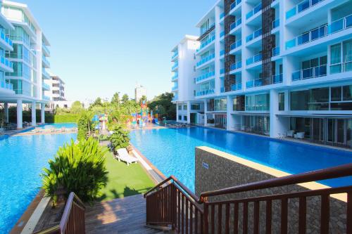 an empty swimming pool in the middle of a building at My Resort Huahin by MR.JAY in Hua Hin