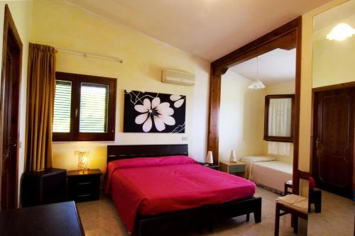 Postel nebo postele na pokoji v ubytování Hotel Paola