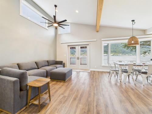 a living room with a couch and a table at Oceanfront w Incredible Views in Juneau
