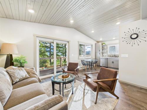 a living room with a couch and chairs and a table at Sunny Point 2BR with Deck & Mountain Views in Juneau