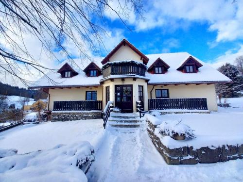 a house covered in snow in the snow at Naruby Ubytování in Mařov u Úpice