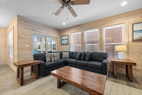 a living room with a couch and a table at Hammock Dunes J by Youngs Suncoast in Orange Beach