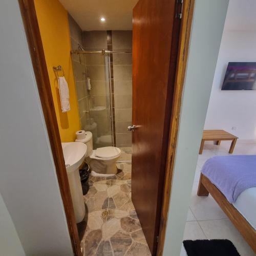 a bathroom with a toilet and a shower at Dreimar Hotel Boutique in Cartagena de Indias
