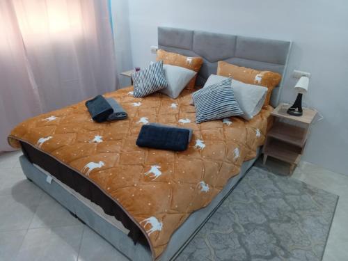 a bedroom with a large bed with pillows on it at Hostel Dar Khelifa in Tétouan