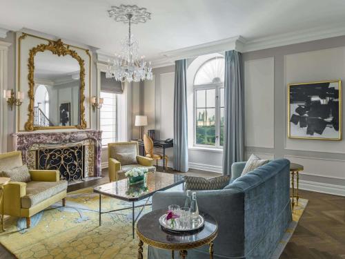 a living room with a couch and a table at The Plaza, A Fairmont Hotel in New York