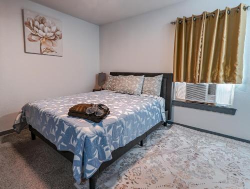 a bedroom with a bed and a window at FIFA World Cup - Stylish 2 BR 1 Bath home with fenced yard near AT&T Stadium, Globe Life, Six Flags & More in Arlington