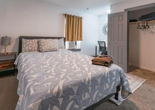a bedroom with a large bed and a window at FIFA World Cup - Stylish 2 BR 1 Bath home with fenced yard near AT&T Stadium, Globe Life, Six Flags & More in Arlington