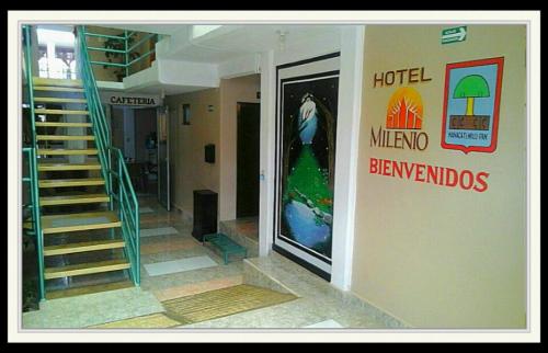 a building with a spiral staircase and a hotel mermozbenheimheim doors at Hotel Milenio Nanacamilpa Tlaxcala in Nanacamilpa