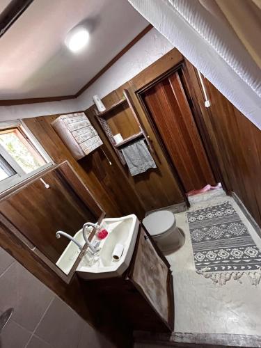 a bathroom with a sink and a toilet at Eywa in Punta Del Diablo