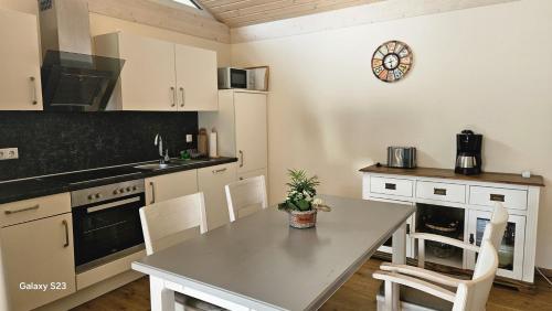 a kitchen with a table and chairs in a room at Andreas in Lenz
