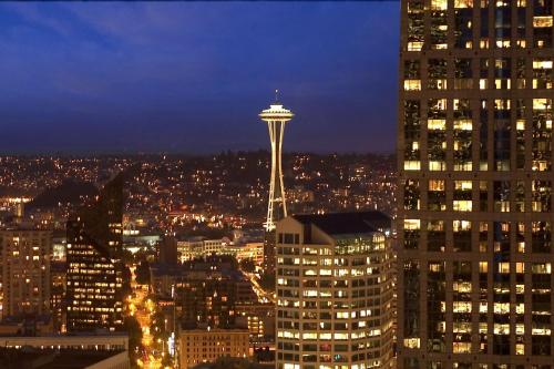 a view of a city at night with a space needle at Crowne Plaza Seattle - No Resort Fee - Newly Renovated IHG Hotel in Seattle