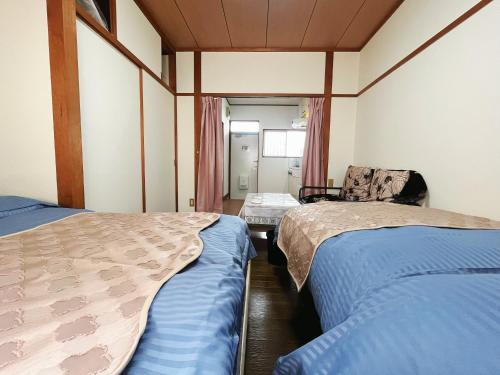 2号房 閑静な住宅街でご宿泊ください 天神博多巨蛋に直行するバスがあります