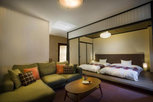 Ένα ή περισσότερα κρεβάτια σε δωμάτιο στο Hotel Hakuba Berghaus
