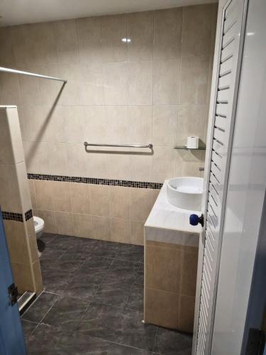 a bathroom with a toilet and a sink at Happy Mind Resort in Sam Roi Yot