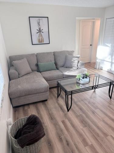 a living room with a couch and a coffee table at Tampa Bays Hidden Gem in Tampa