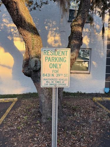 a sign sitting in front of a tree at Tampa Bays Hidden Gem in Tampa