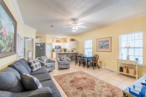 a living room with a couch and a table at Orange Beach Villas - Serendipity in Orange Beach