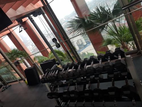 a room with a bunch of chairs in a building at CoLiving Suite, Arquitectura & Vista Premium in Mexico City