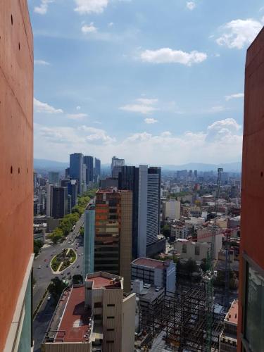 a view of a city from a building at CoLiving Suite, Arquitectura & Vista Premium in Mexico City