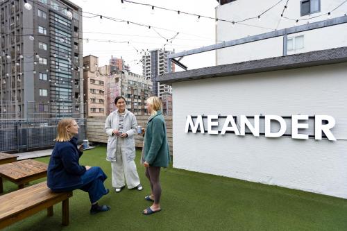 a group of people standing on top of a building at MEANDER Taipei in Taipei