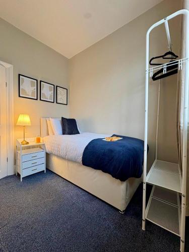 a bedroom with a bunk bed and a ladder at Stylish Southend 4 Bed Sleeps 7 FastWifi Secure Driveway Parking by The Opulent Property Project UK in Southend-on-Sea