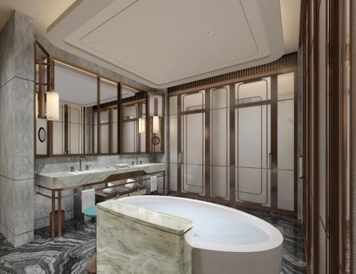 a bathroom with two sinks and a bath tub at Andaz Shanghai ITC in Shanghai