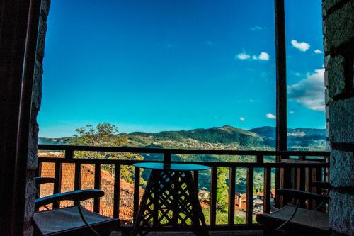 a view from a balcony with a table and chairs at Theasis suites-Ορεινή Φιλοξενία in Kato Trikala Korinthias