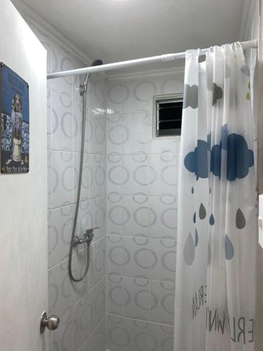 a bathroom with a shower with a shower curtain at Departamento Terraza in Molina