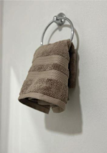 a towel hanging from a towel rack on a wall at Casa Cerritos in Comitán