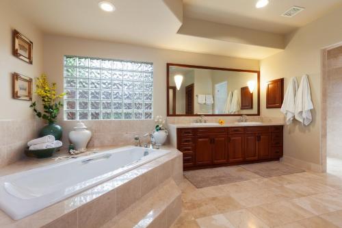 a large bathroom with a large tub and a window at ❤PiH❤ Aloha Palms~ Fully Detached Home Beach Gear Bikes in Waikoloa