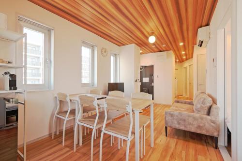a kitchen and dining room with a table and chairs at V Close to Kojiya sta 15 min to Haneda Roof top B in Tokyo