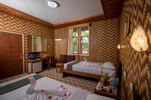 Llit o llits en una habitació de Ruby True Hotel