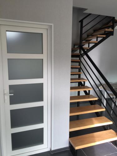 a door leading up to a staircase in a house at Chalet Kokhta in Bakuriani