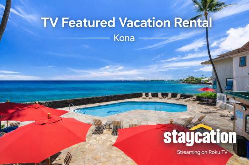 a view of a swimming pool with umbrellas and the ocean at Ocean Echoes: Kona’s Oceanfront Family Oasis in Kailua-Kona