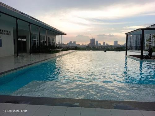 a large swimming pool on the side of a building at Botaniqa Residence in Puchong