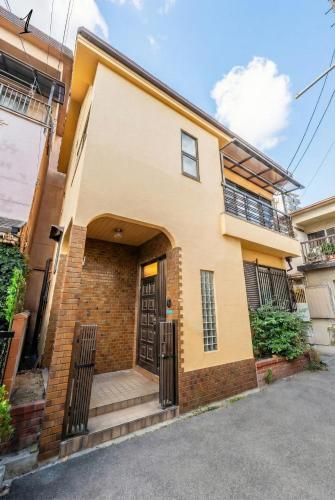 7BR Entire 2-House Rental Sleeps 12 Theater and Games Umeda 3 Min