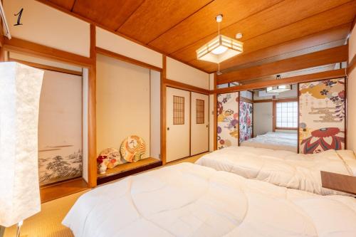 7BR Entire 2-House Rental Sleeps 12 Theater and Games Umeda 3 Min