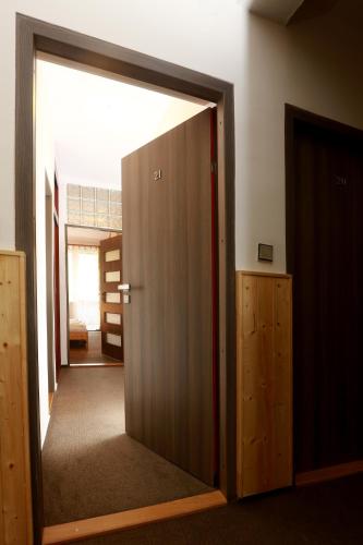 an open door to a room with a hallway at Hotel Zimní stadion Náchod in Náchod