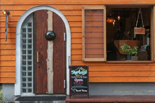 a store with a sign in front of a door at SappoLodge in Sapporo