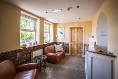 a waiting room with a couch and a table at Thomas Wright House in Byers Green