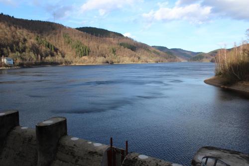 a view of a river with mountains in the background at Ferienappartement Archimedes in Walkenried