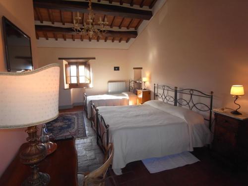 Postel nebo postele na pokoji v ubytování Agriturismo I Pagliai